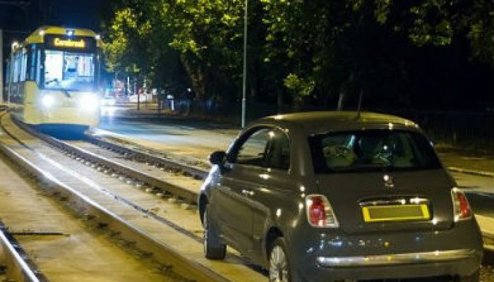 Chaos as motorist approaches oncoming tram and gets stuck