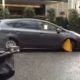 Video: motorist tries to drive off with a clamp on his car
