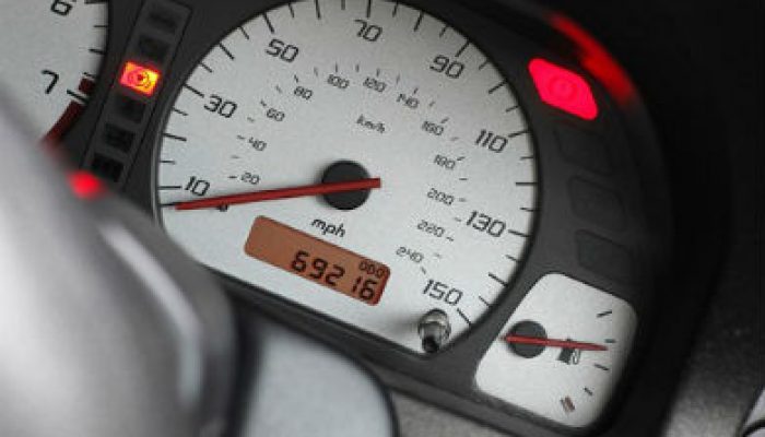 Car dealer pleads guilty to selling clocked cars