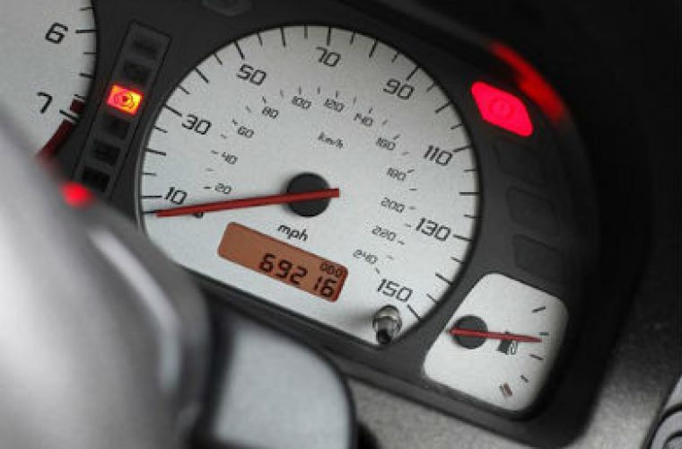 Car dealer pleads guilty to selling clocked cars
