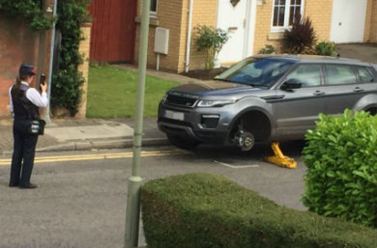 Traffic warden fines broken down car while parked illegally herself