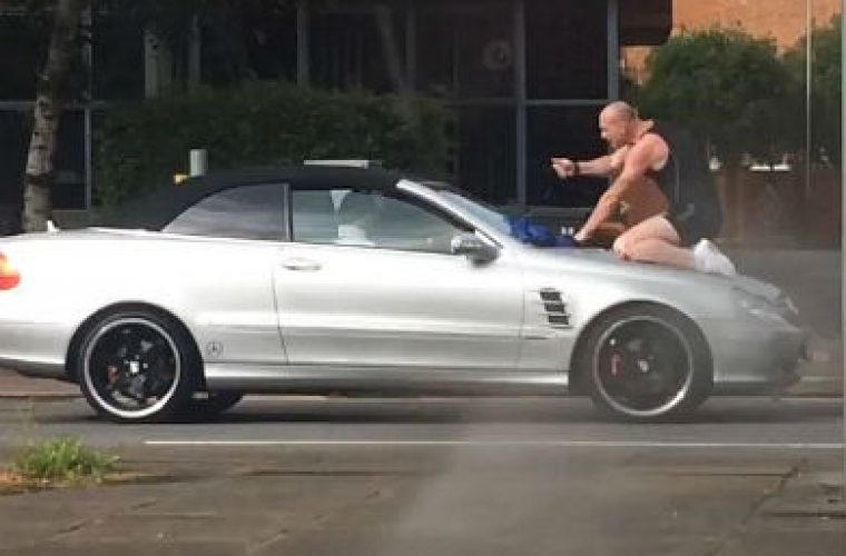Video: Man climbs on moving Merc to punch and headbutt windscreen