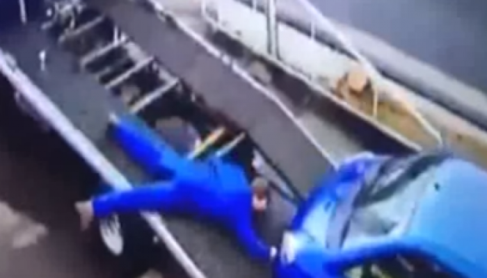 Video: Panic as mechanic gets dragged off truck by runaway car