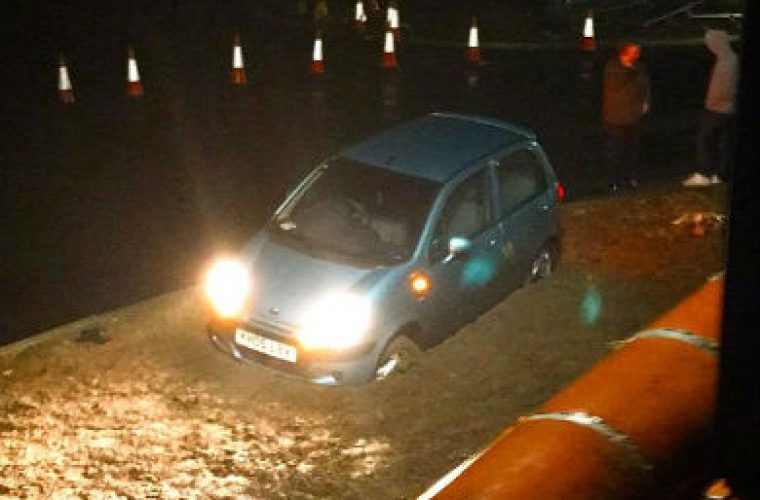 Motorist gets stuck in wet cement after pranksters move cones