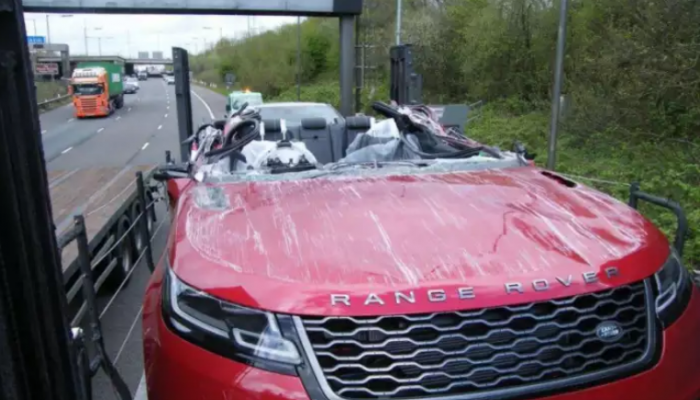 Brand new Range Rover has its roof ripped off when transporter hit M61 bridge