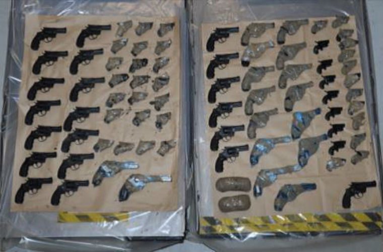 Police seize arsenal of 90 guns hidden in engines