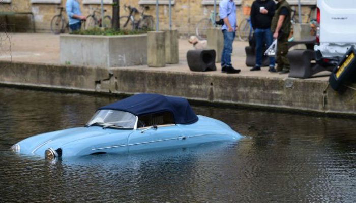 Porsche 356 replica gets knocked into canal by passing van