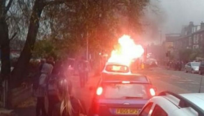 BMW bursts into flames outside primary school
