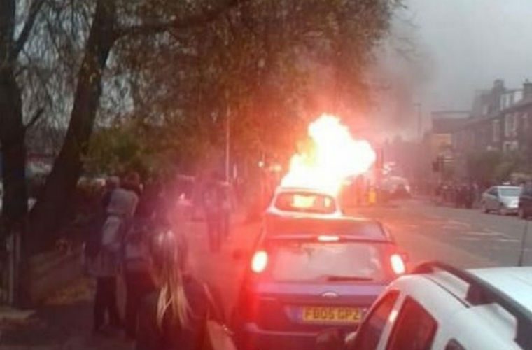 BMW bursts into flames outside primary school