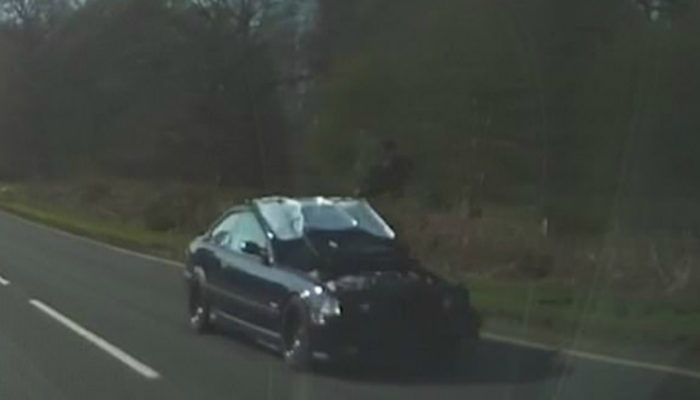 Motorist caught driving along busy A road with bonnet up