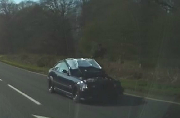 Motorist caught driving along busy A road with bonnet up