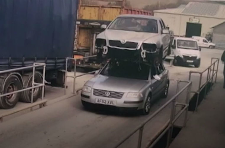 Video: Man fined for driving car with another car on its roof