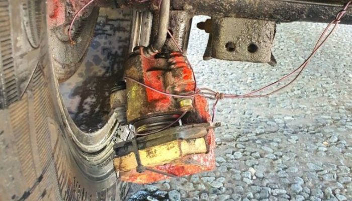 Police stop car with bodged brake caliper dangling off