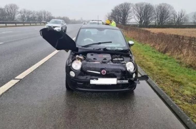Police stop drunk driver after spotting bonnet hanging off