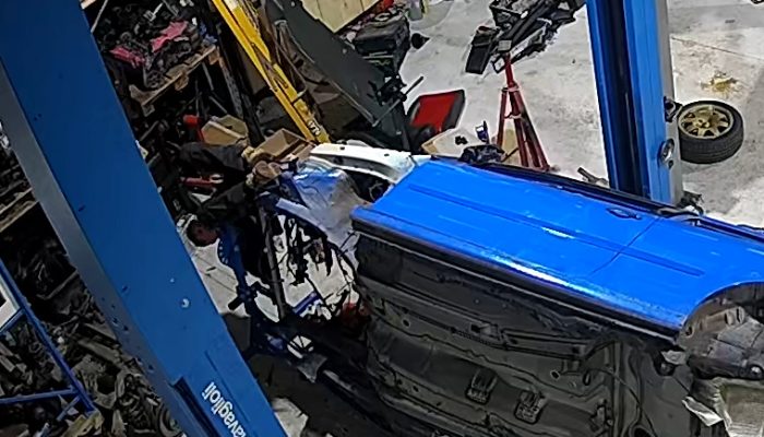 VIDEO – Mechanic flips car and himself in rollover jig accident