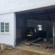 Car plows into Devon garage after motorcycle collision